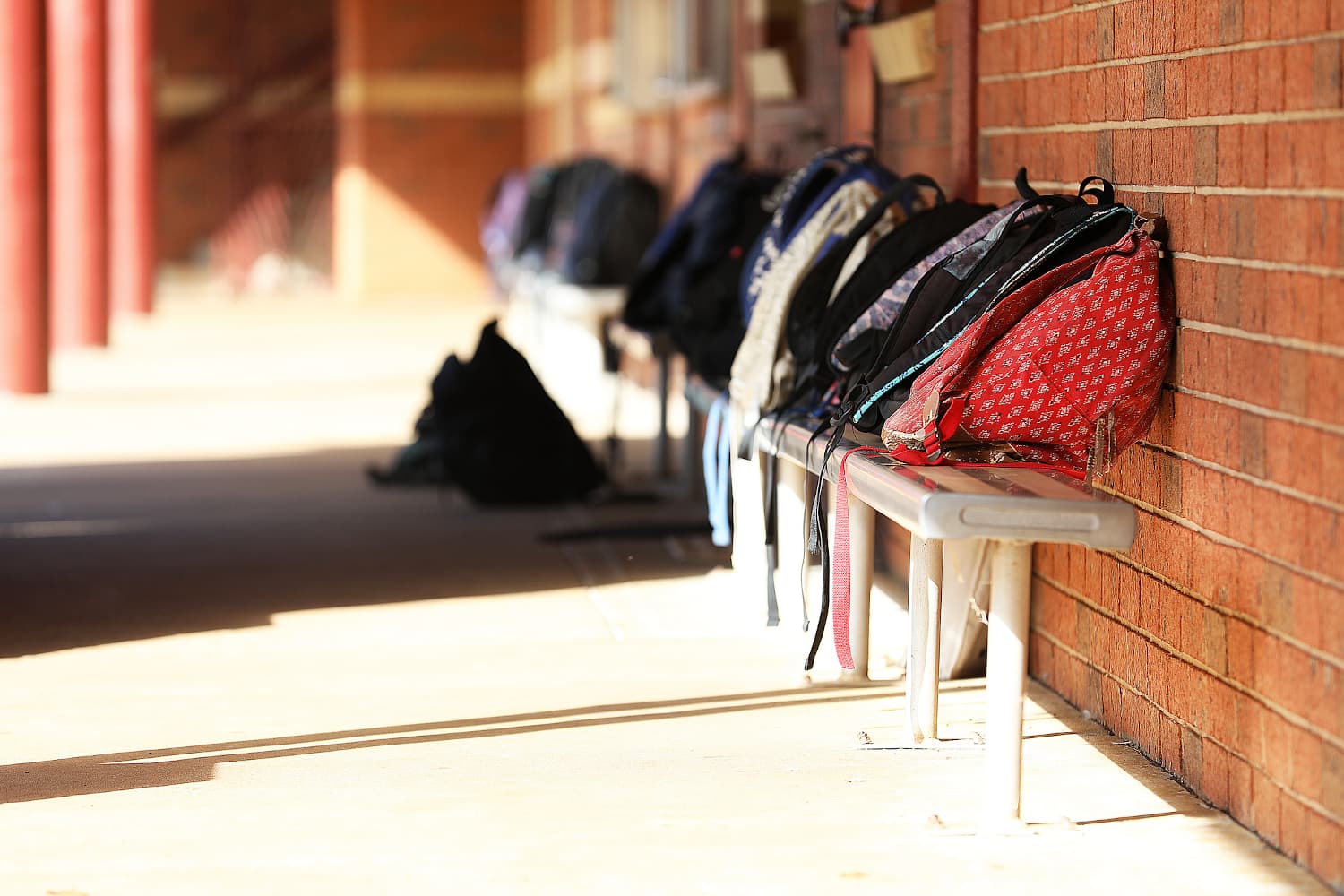 High School student school bags outside the classroom at an educational
